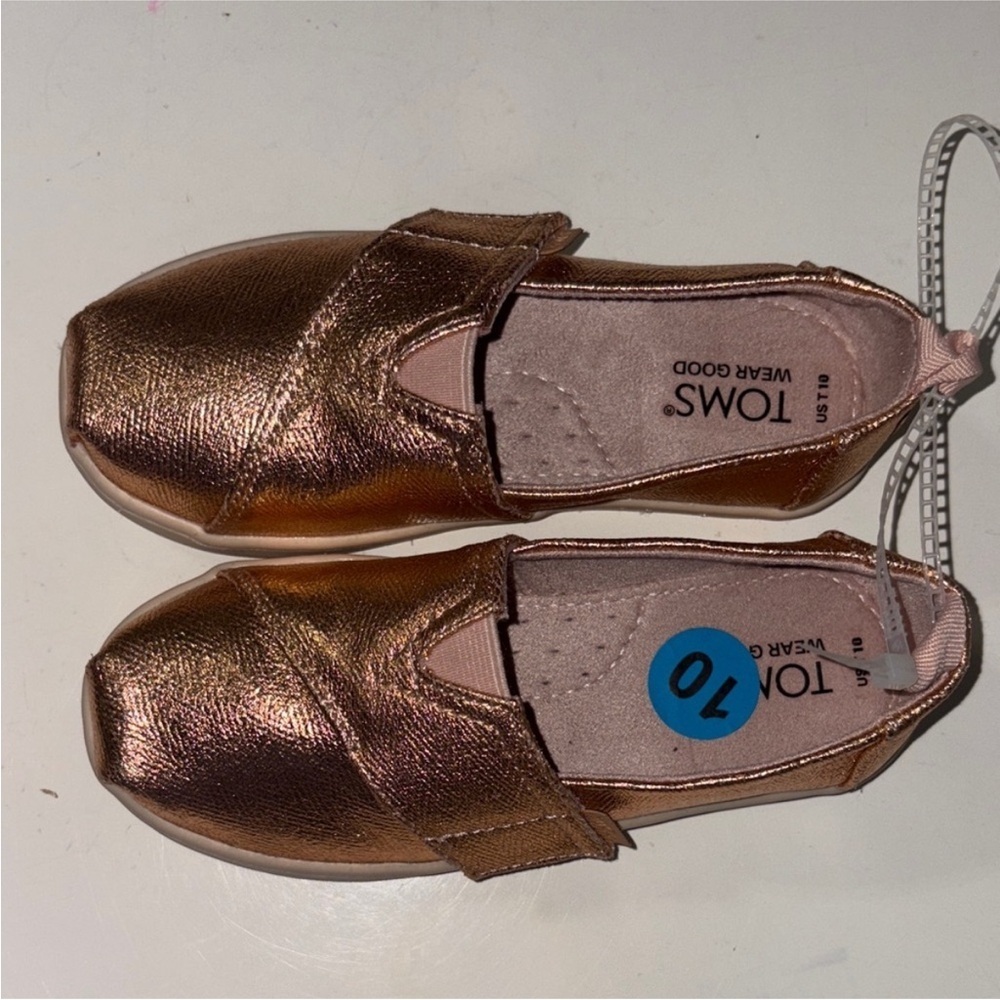 244. TOMS Kids Shiny Bronze Moccasins Toddler Size 10